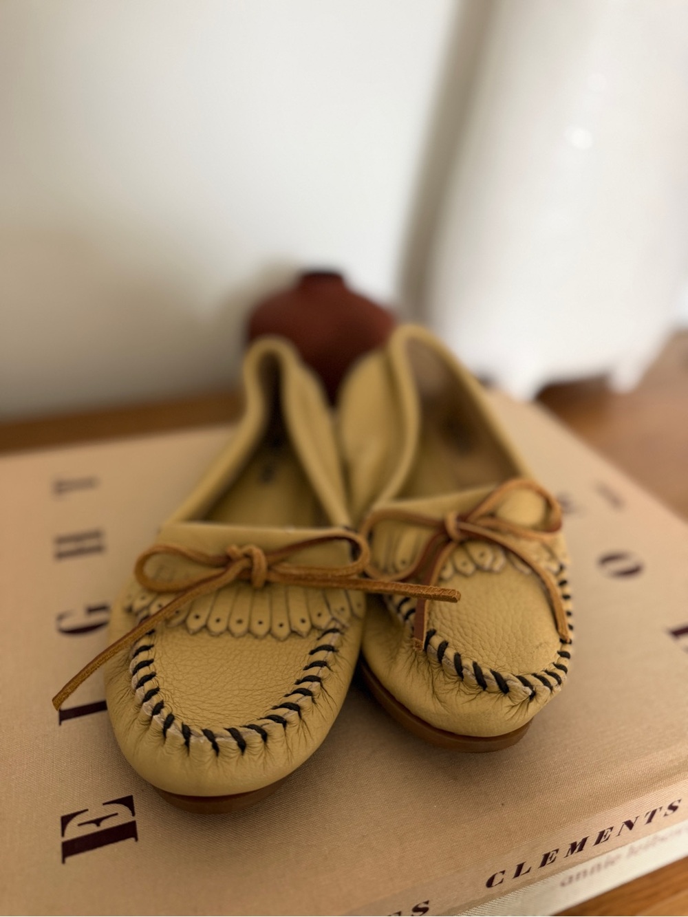 Minnetonka Cream Leather Moccasin Flats with Bow and Fringe